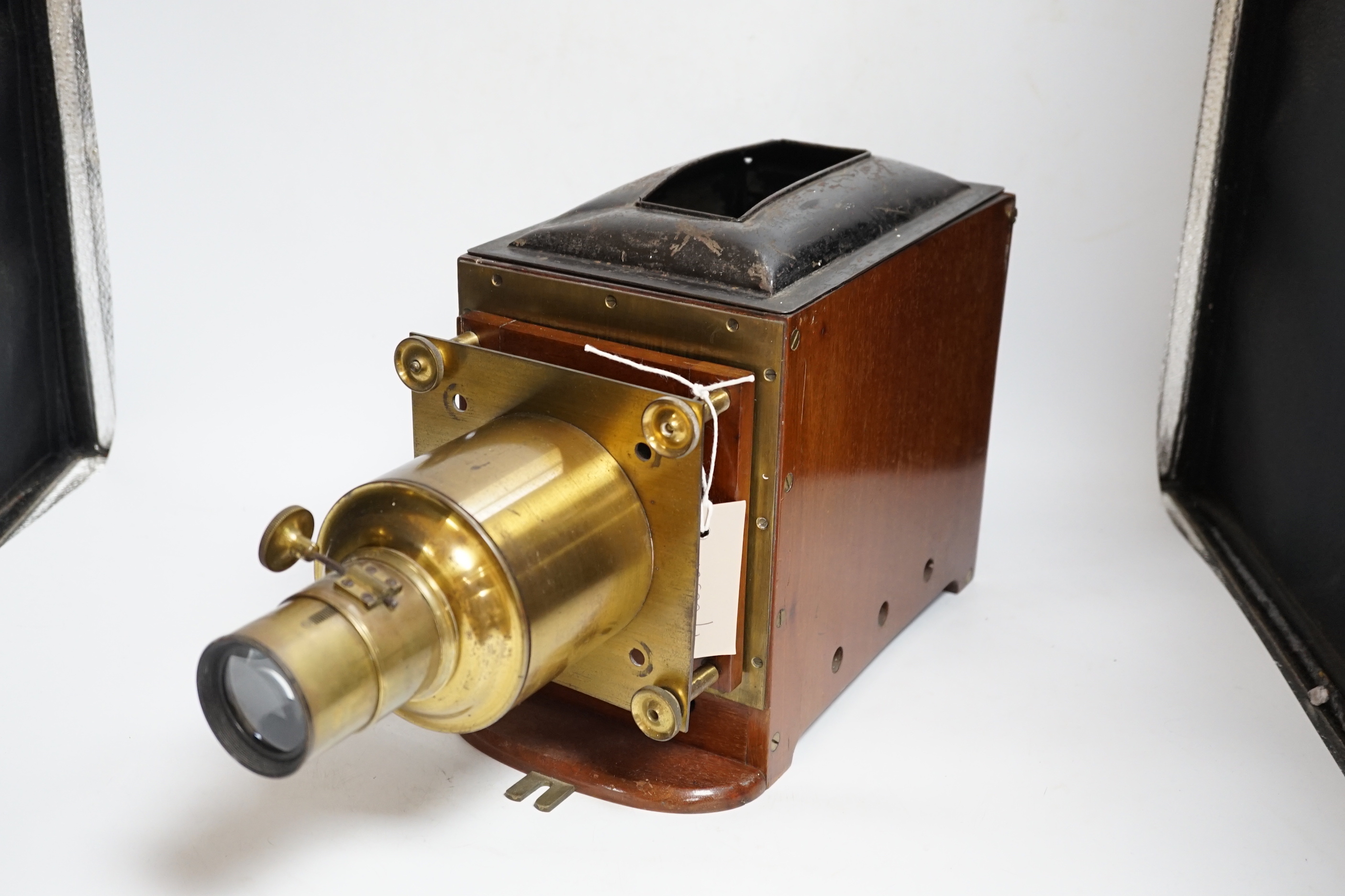 A late Victorian brass mounted mahogany magic lantern by Dunscombe, Bristol with a small quantity of slides (converted to electricity)